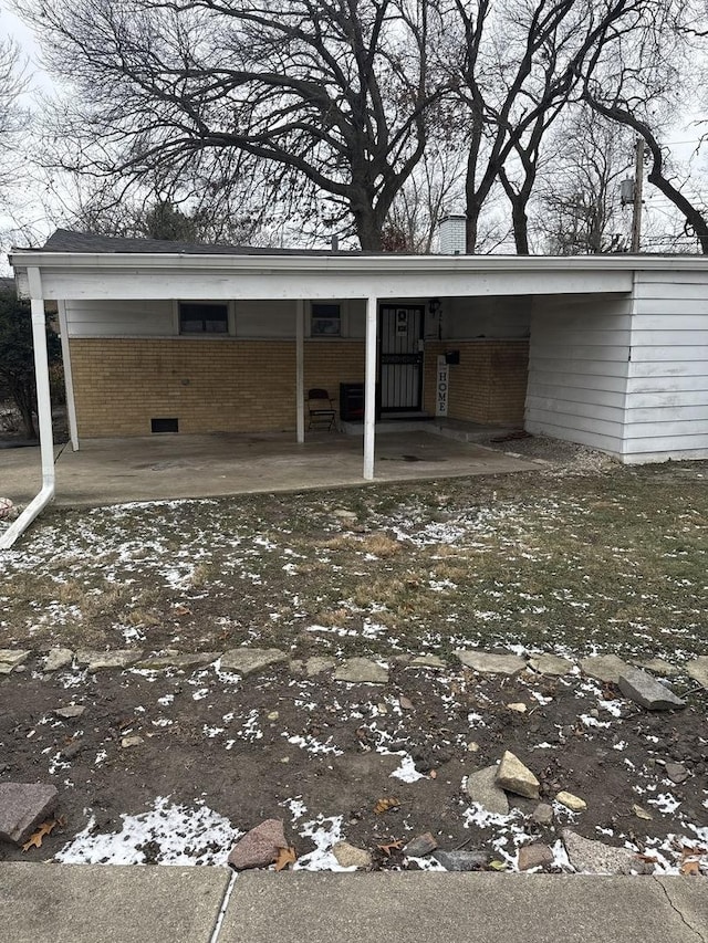 exterior space with a carport