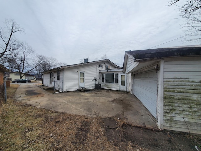 back of house featuring cooling unit and a patio area