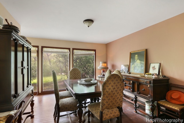 dining area with dark wood-style floors