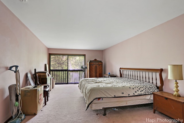carpeted bedroom featuring access to exterior