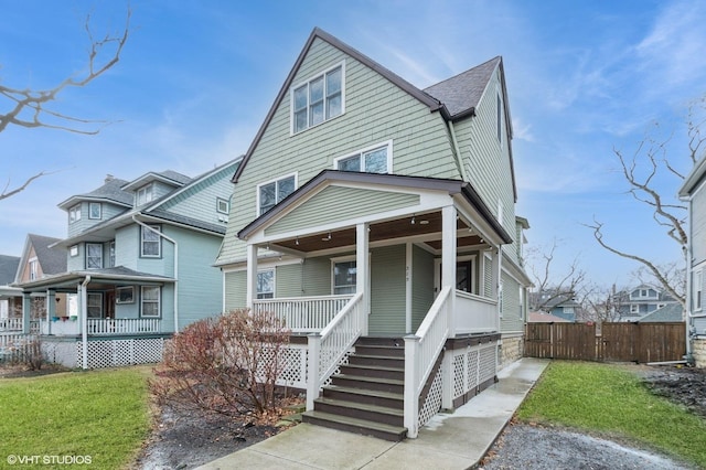 view of front of house with a front lawn and covered porch