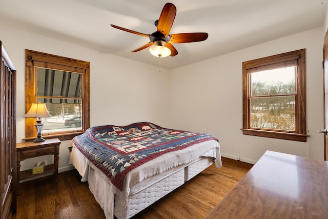 bedroom featuring dark wood-type flooring and ceiling fan