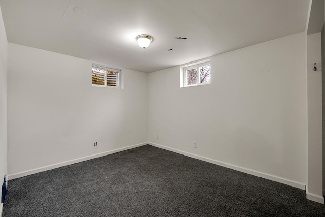 basement featuring dark colored carpet