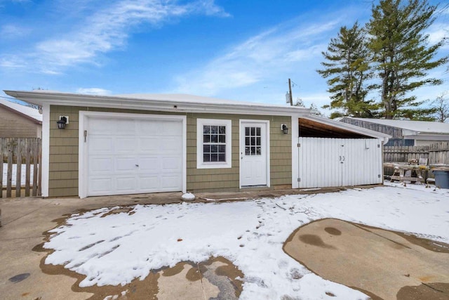 view of snow covered garage