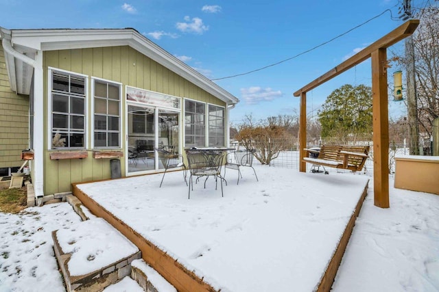 view of snow covered deck