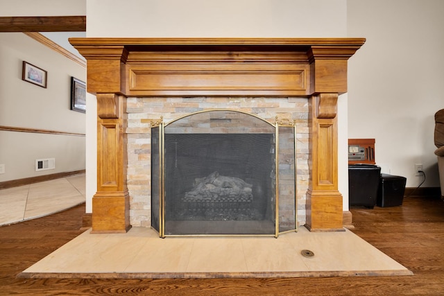 details featuring crown molding and hardwood / wood-style floors