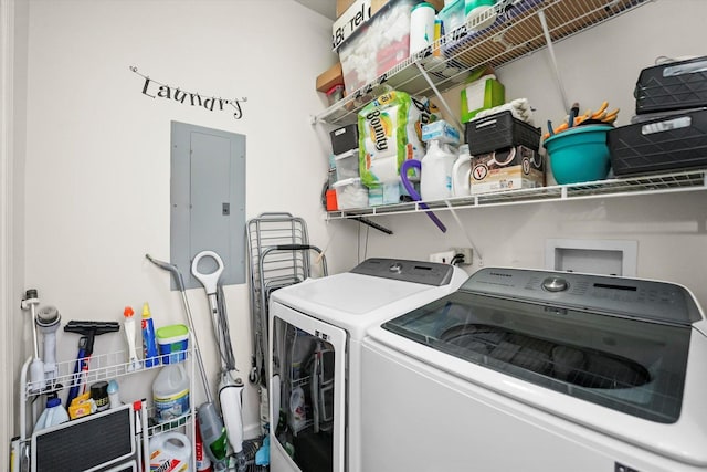 laundry room featuring laundry area, electric panel, and washing machine and clothes dryer