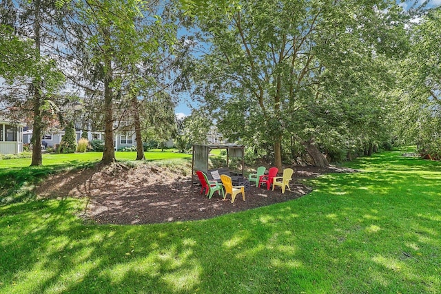 view of playground with a lawn