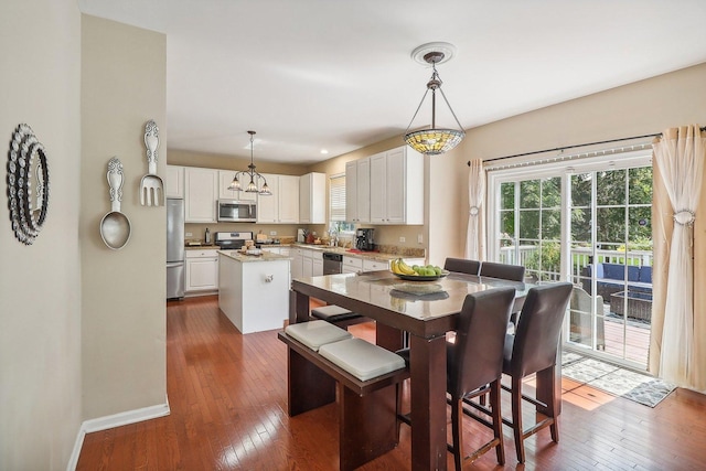 dining area featuring dark hardwood / wood-style flooring