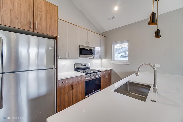 1734 W Cullerton St, Chicago, IL 60608 - kitchen with appliances with stainless steel finishes, tasteful backsplash, lofted ceiling, white cabinets, and hanging light fixtures