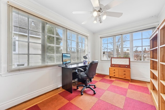 home office featuring ceiling fan and baseboards