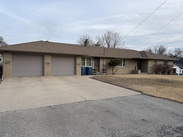 ranch-style home featuring a garage