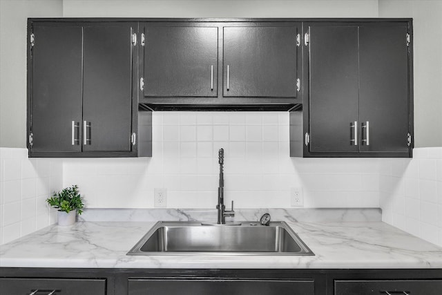 kitchen featuring sink and decorative backsplash