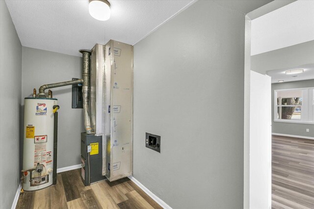 utility room with water heater