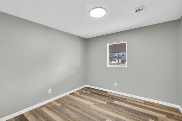 empty room featuring hardwood / wood-style floors