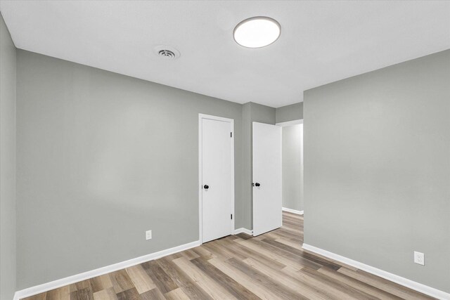 empty room with light wood-type flooring