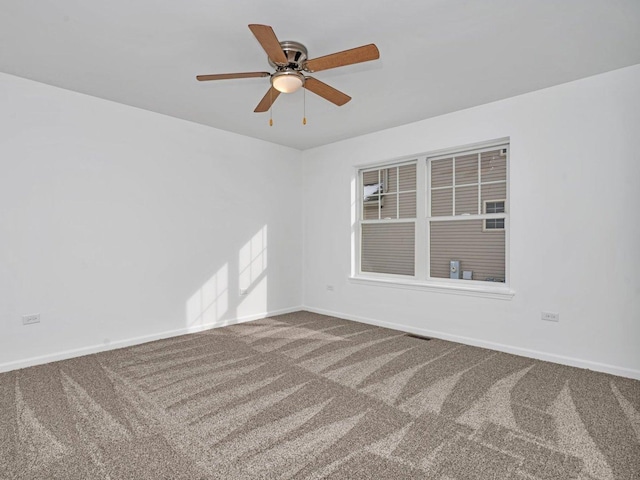 spare room with ceiling fan and carpet flooring