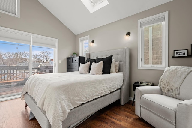 bedroom with dark hardwood / wood-style flooring, access to exterior, and lofted ceiling with skylight