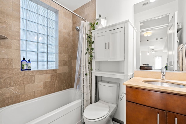 full bathroom with vanity, toilet, a healthy amount of sunlight, and shower / bath combo with shower curtain