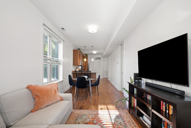 living room with light hardwood / wood-style flooring