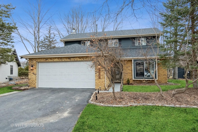 view of front of property with aphalt driveway, roof with shingles, an attached garage, a front lawn, and brick siding