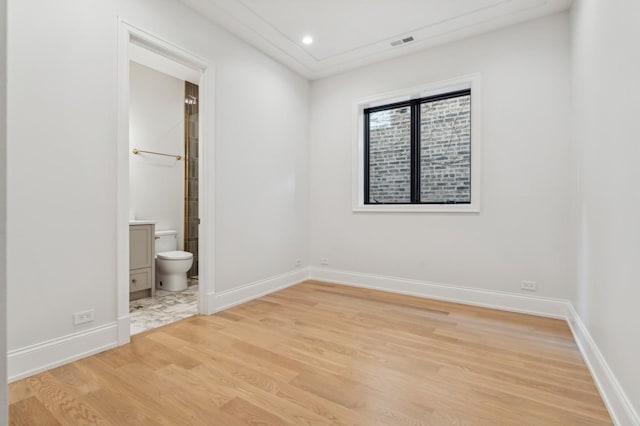 unfurnished room with light hardwood / wood-style floors