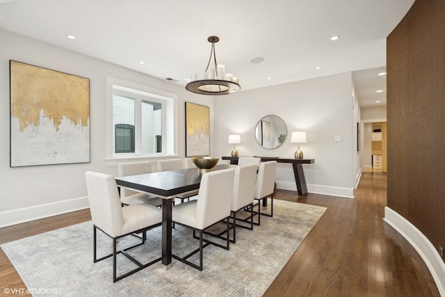 dining room with recessed lighting, wood finished floors, and baseboards