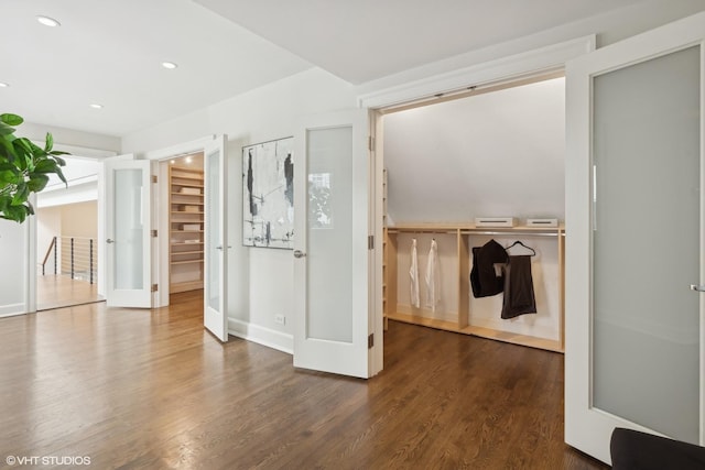 interior space featuring french doors, wood finished floors, and recessed lighting