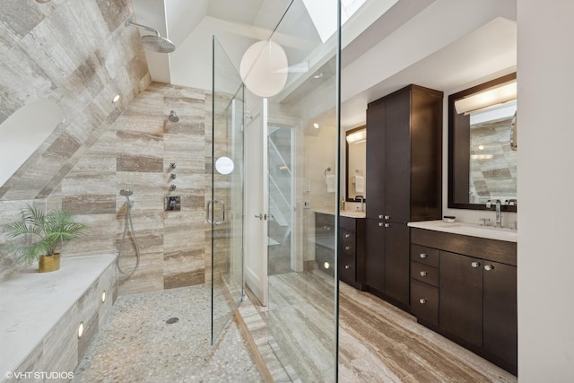 bathroom with a stall shower and vanity