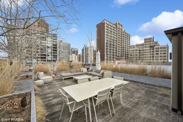 view of patio / terrace featuring a view of city and an outdoor hangout area