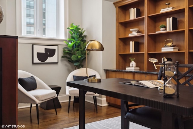 home office featuring baseboards and wood finished floors