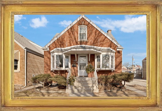 view of front of property featuring brick siding