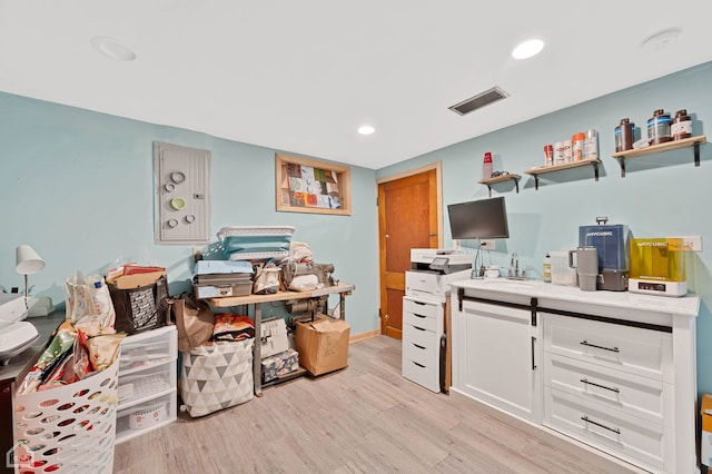 home office featuring light wood-style flooring, visible vents, and recessed lighting