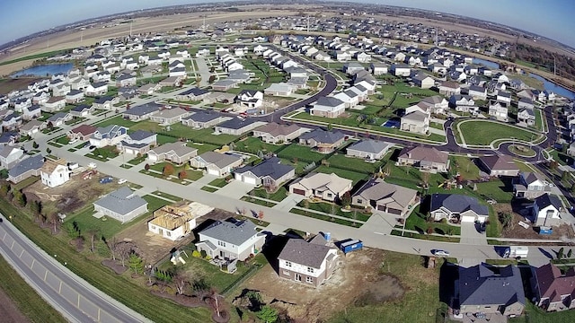 birds eye view of property featuring a residential view and a water view