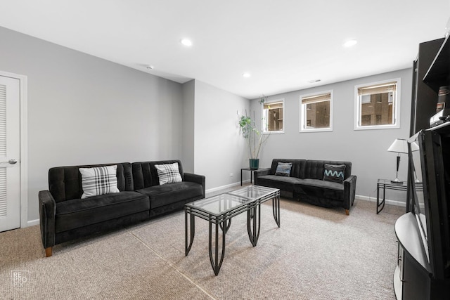 living area featuring light carpet, recessed lighting, and baseboards