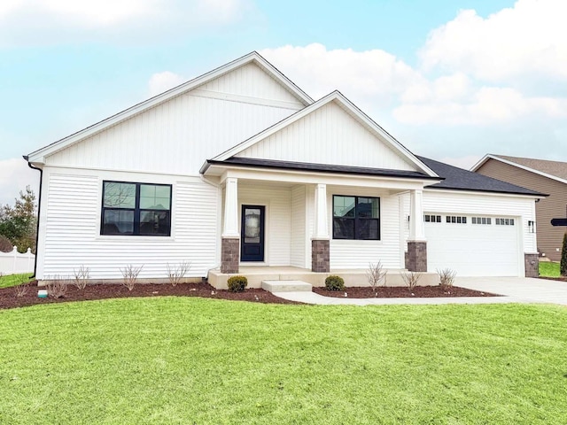 view of front of property featuring a garage and a front yard