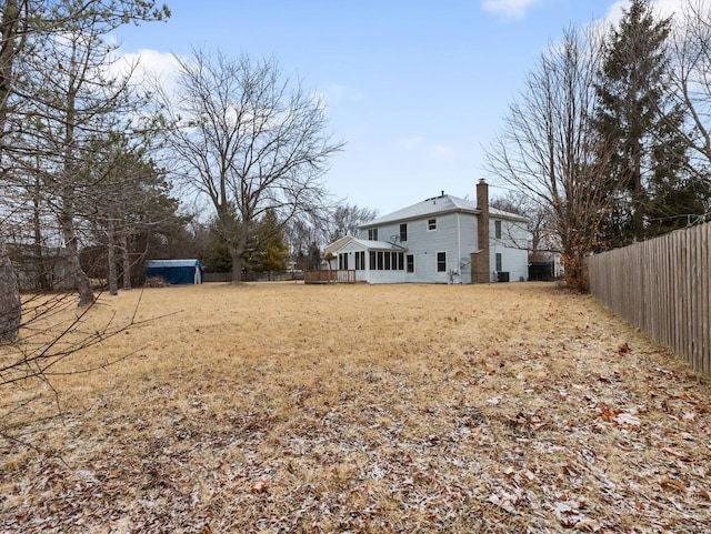 view of yard featuring a sunroom