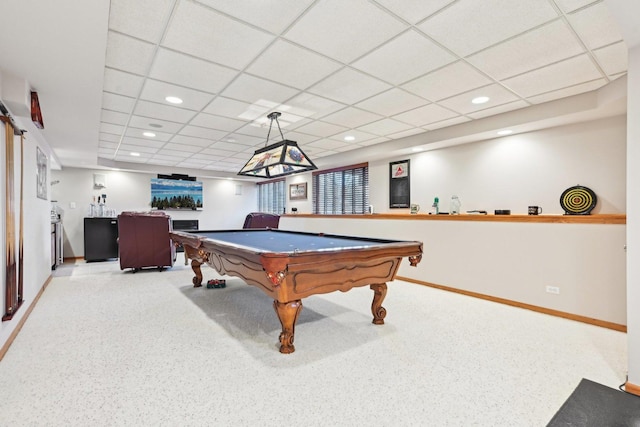 recreation room with pool table, a paneled ceiling, and light carpet