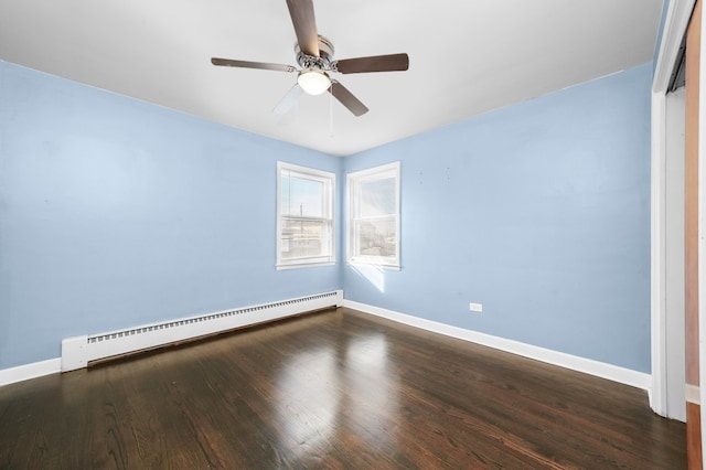 empty room featuring a baseboard heating unit, dark hardwood / wood-style floors, and ceiling fan