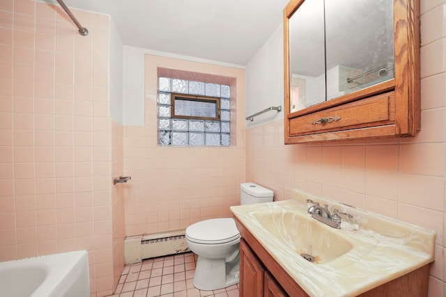 bathroom with a baseboard radiator, tile walls, tile patterned flooring, vanity, and toilet