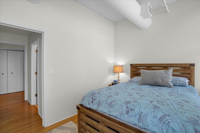 bedroom featuring wood-type flooring