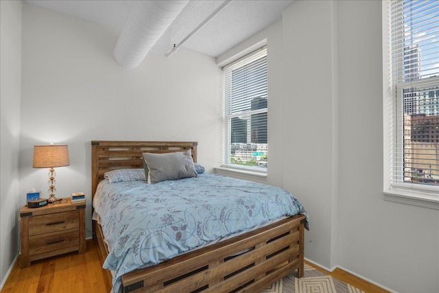 bedroom with light hardwood / wood-style flooring