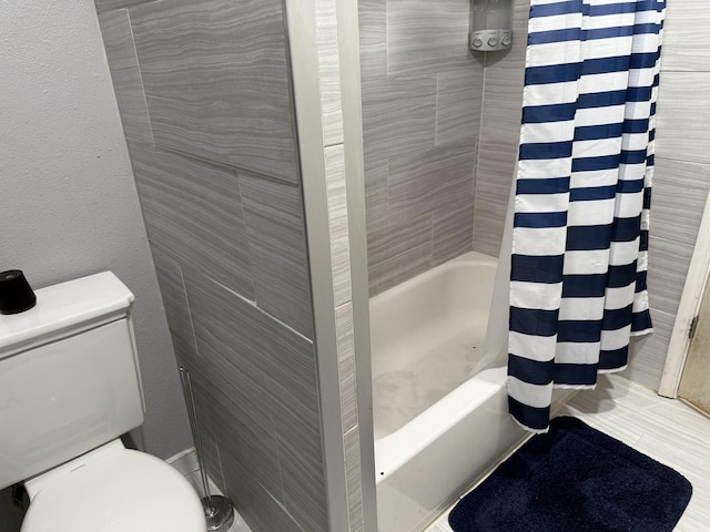 bathroom featuring tile walls, shower / bathtub combination with curtain, and toilet