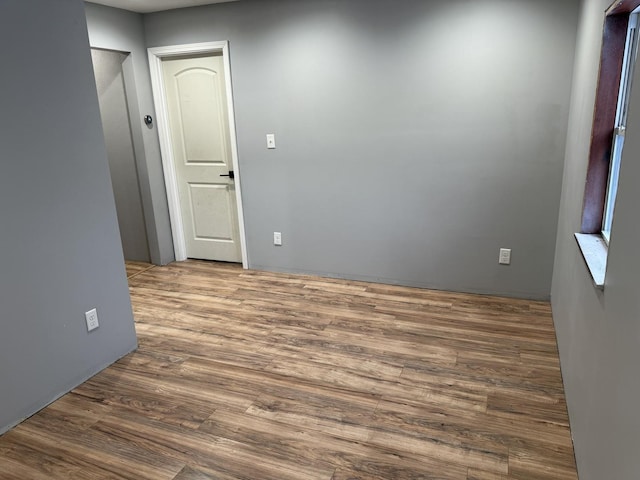 spare room with dark hardwood / wood-style floors