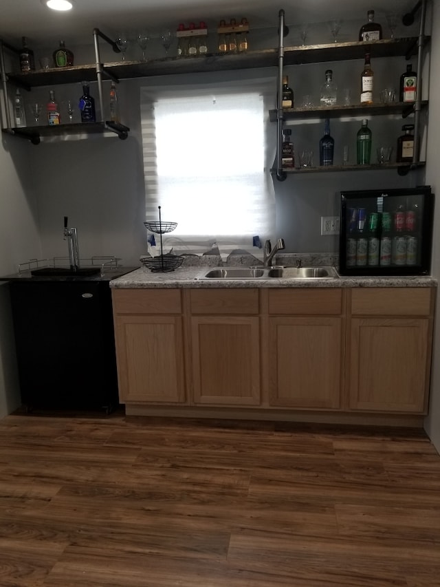 kitchen featuring sink, dark wood-type flooring, and light brown cabinets