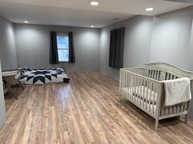 bedroom featuring wood-type flooring