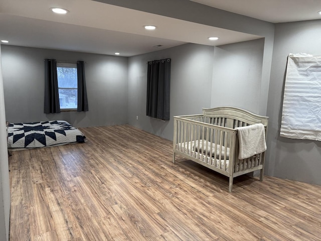 bedroom with hardwood / wood-style floors