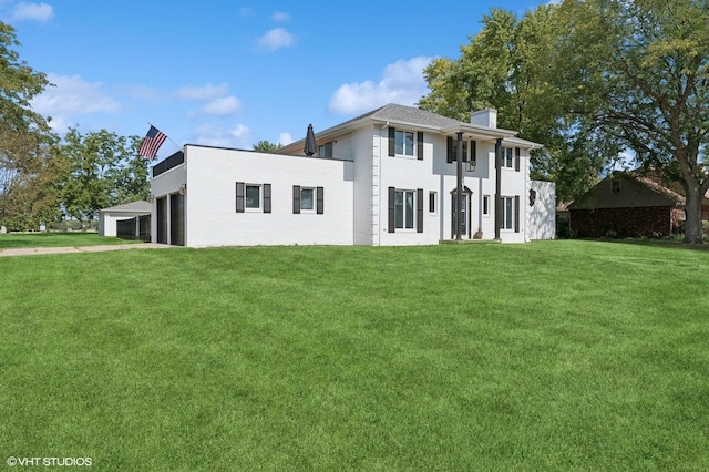 view of front of property featuring a garage and a front yard