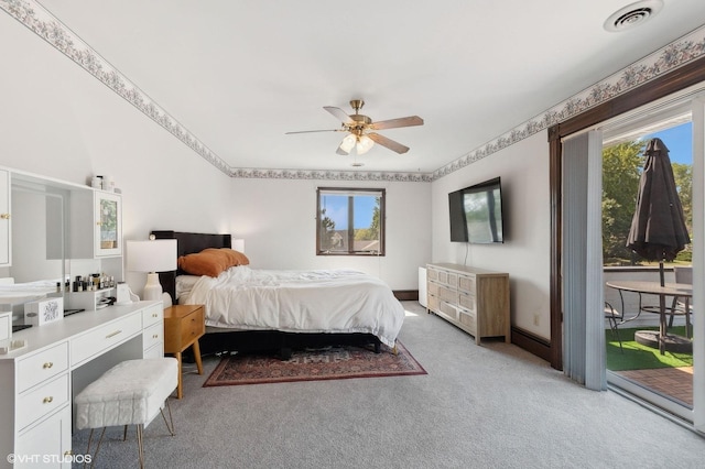 carpeted bedroom with access to exterior and ceiling fan