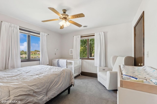 carpeted bedroom with ceiling fan